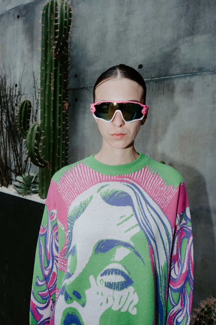 A student’s finished pink and green knitwear from the MHPI × SXEMA course